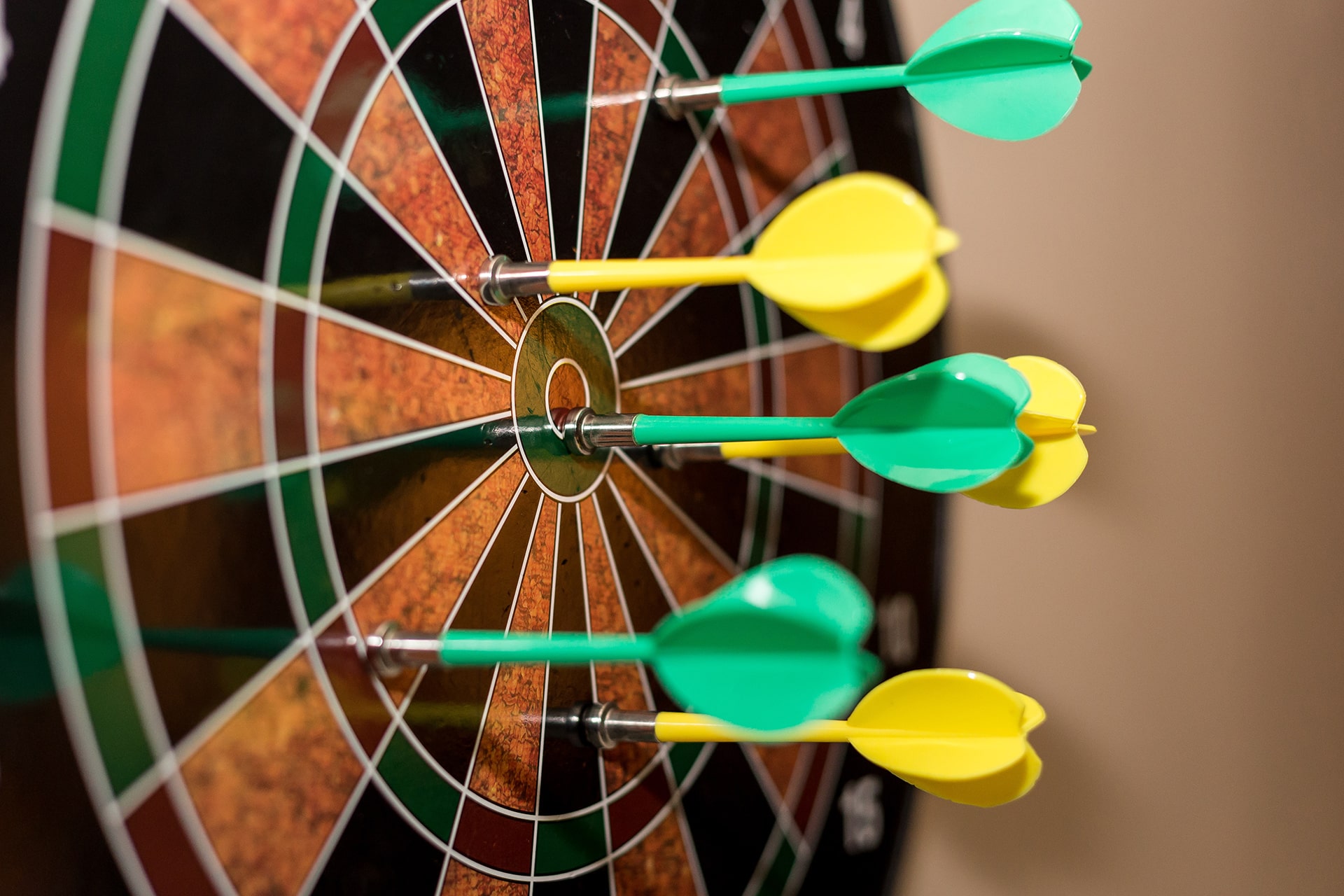 Two sets of darts in a board. Photo by Marc A on Unsplash - https://unsplash.com/@grvault?utm_source=unsplash&utm_medium=referral&utm_content=creditCopyText